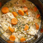 CrockPot Chicken and Dumplings is a creamy, cozy slow cooker meal made with tender chicken, fluffy biscuits, and classic flavors.