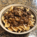 Crockpot Beef Tips and Noodles is a hearty, tender slow cooker recipe with savory gravy and egg noodles. Easy comfort food at its best!