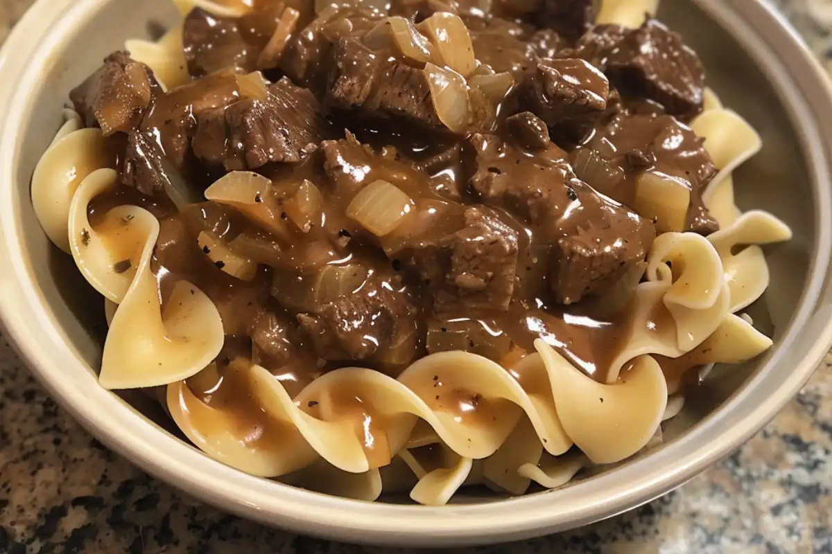 Crockpot Beef Tips and Noodles is a hearty, tender slow cooker recipe with savory gravy and egg noodles. Easy comfort food at its best!