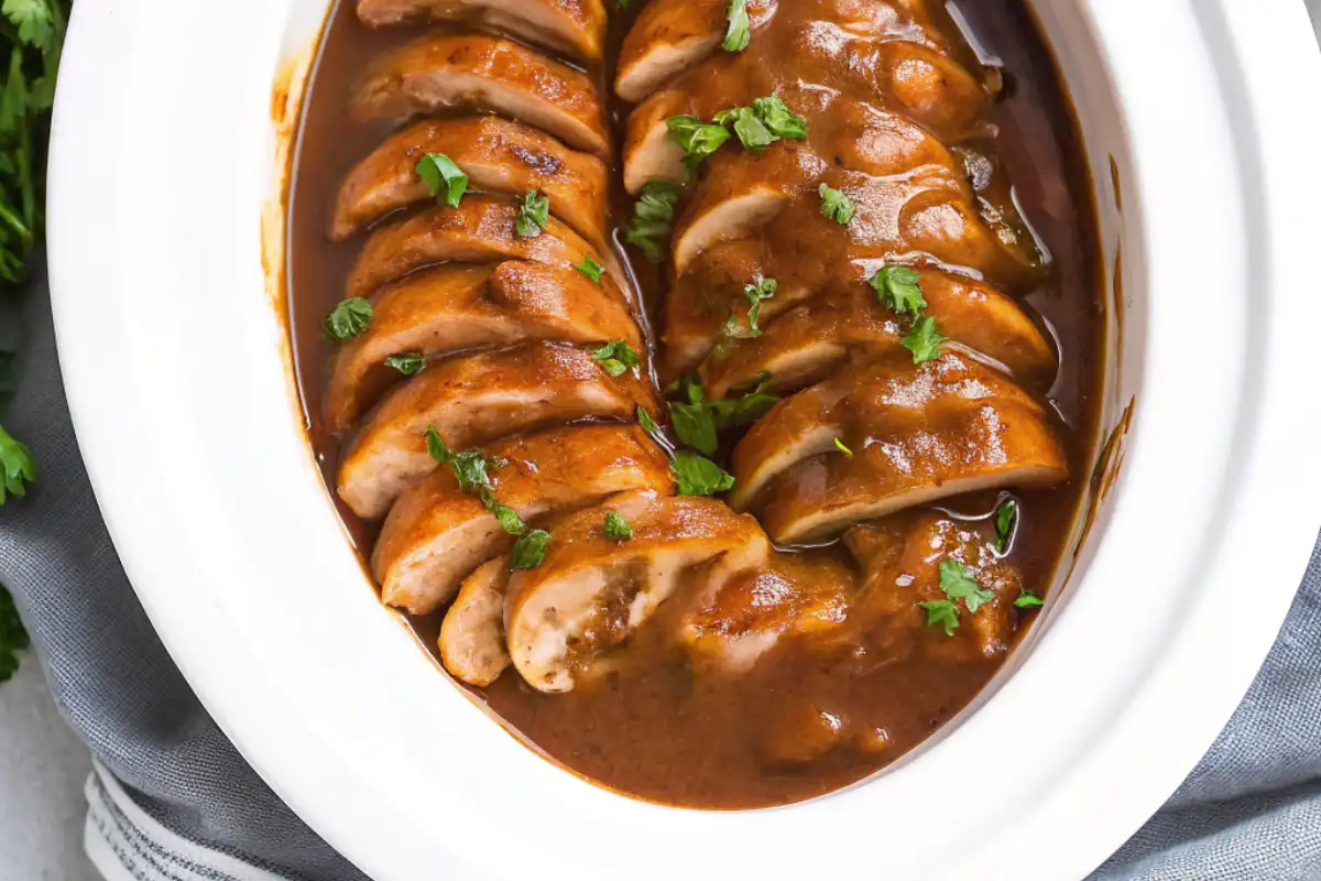 This Slow Cooker Pork Tenderloin is juicy, tender, and packed with flavor. A simple and delicious crock pot recipe perfect for any night!