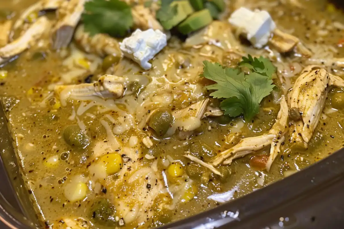 Creamy and zesty Crock Pot Green Enchilada Chicken Soup is easy, flavorful, and perfect for cozy nights. Dump-and-go slow cooker meal!