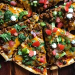 Homemade Mexican Pizza features crispy tortillas, seasoned beef, refried beans, cheese & toppings—a bold, cheesy Tex-Mex classic!