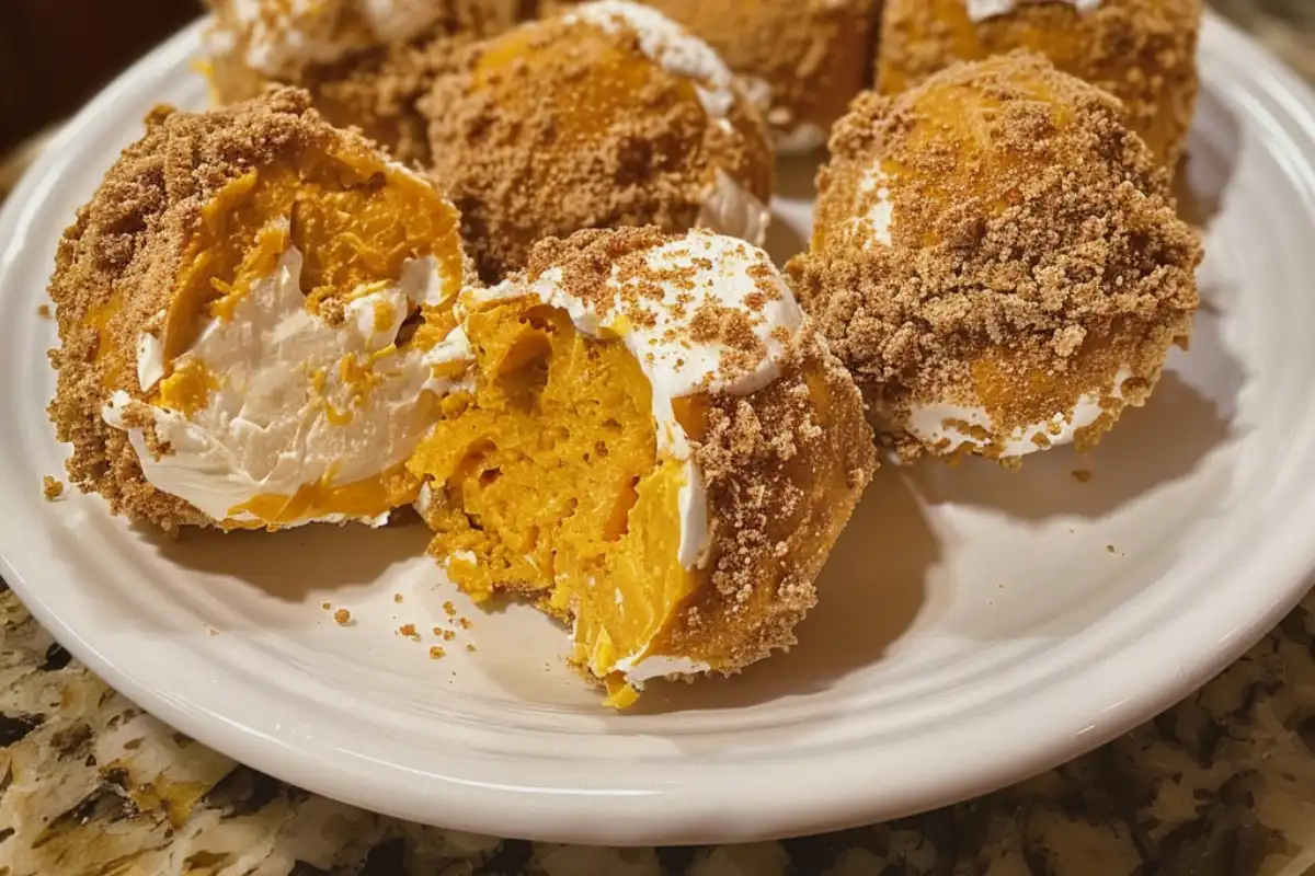 No-Bake Pumpkin Cheesecake Balls are creamy, spiced, and coated in white chocolate—an easy fall treat for snacking, gifting, or parties!