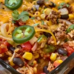 This One-Pan Mexican Rice Casserole is a hearty, cheesy dinner loaded with beef, rice, veggies, and bold Tex-Mex flavor—all in one skillet!