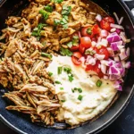 Slow Cooker Chicken Shawarma is packed with warm Middle Eastern spices and tender chicken—perfect for wraps, bowls, or platters!