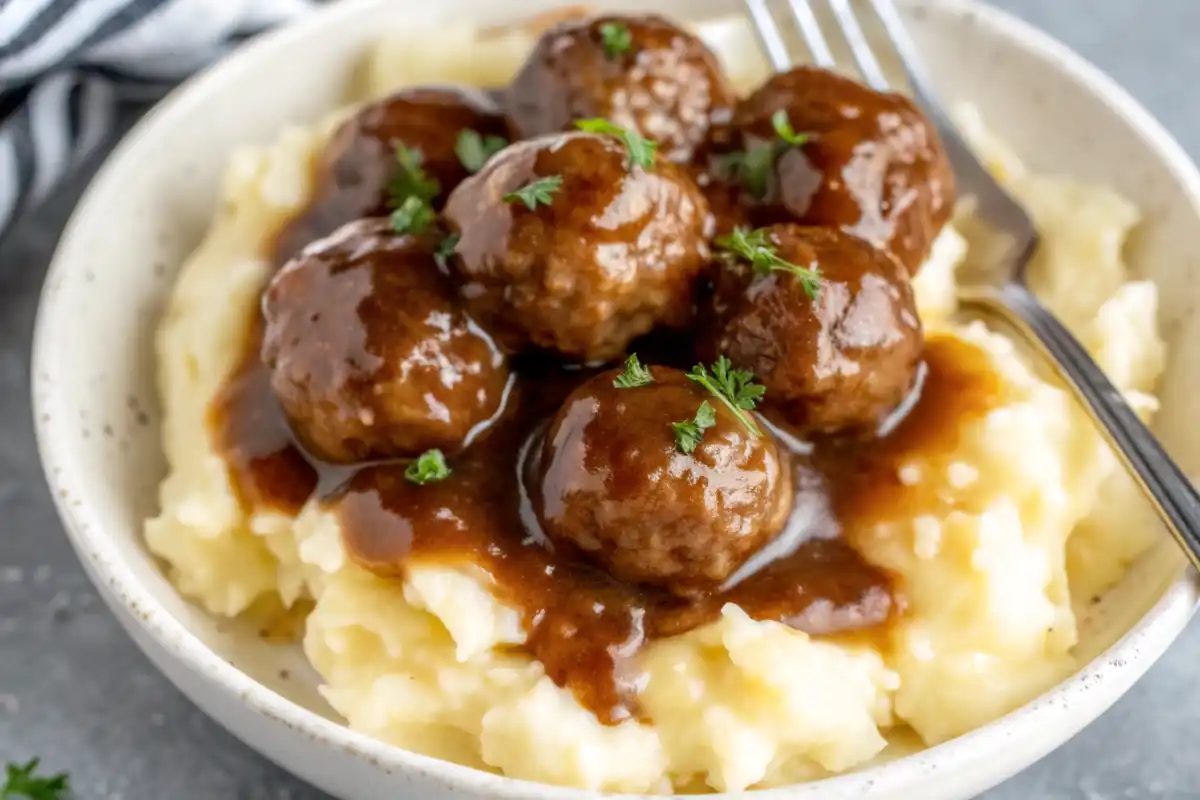 These Slow Cooker Salisbury Steak Meatballs are tender, juicy, and simmered in rich brown gravy—perfect over mashed potatoes or noodles!
