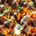 This Steak Queso Rice is a bold and cheesy one-pan meal packed with juicy steak, creamy queso, and fluffy rice for pure comfort food bliss.