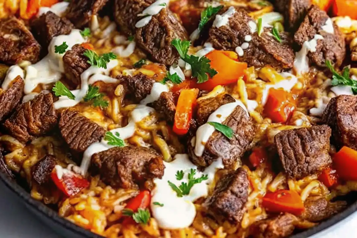This Steak Queso Rice is a bold and cheesy one-pan meal packed with juicy steak, creamy queso, and fluffy rice for pure comfort food bliss.