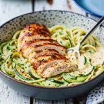 Zucchini Noodle Chicken Alfredo is a creamy, low-carb dinner packed with tender chicken, zoodles, and rich garlic parmesan Alfredo sauce.