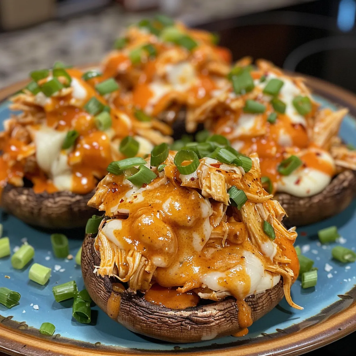 These Buffalo Chicken Stuffed Mushrooms are spicy, cheesy, and baked to perfection. The ultimate party appetizer or game day snack!