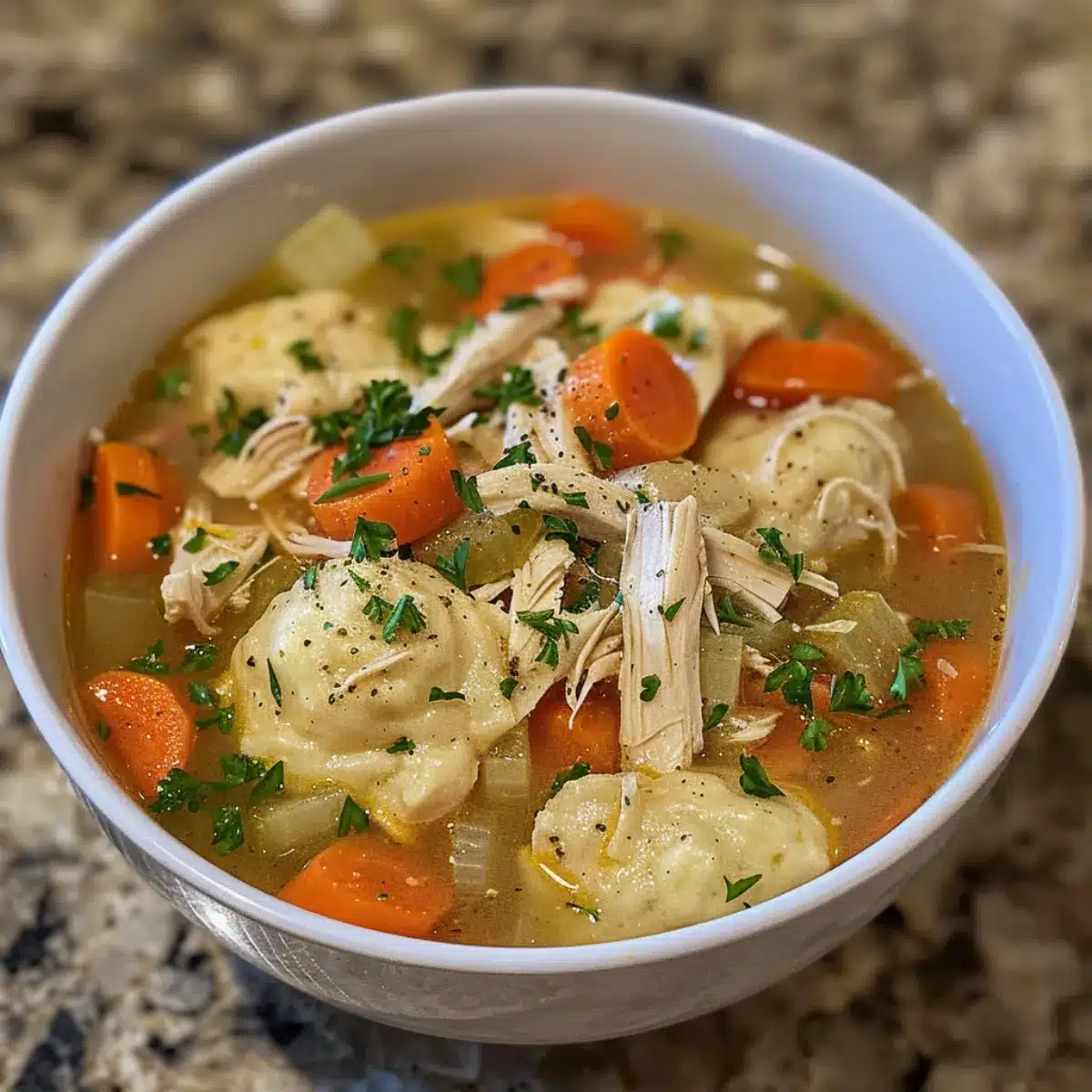 This chicken & dumplings soup is creamy, hearty, and full of tender chicken, fluffy dumplings, and veggies—your ultimate cozy comfort food!
