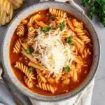 This crockpot chicken parmesan soup is rich, cheesy, and full of Italian flavor—perfect for comforting dinners with garlic bread!