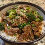 This Slow Cooker Broccoli Beef recipe makes tender beef and crisp broccoli in a savory garlic soy sauce—better than takeout and so easy!