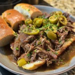 Slow Cooker Italian Beef Sandwiches are tender, juicy, and full of bold Italian flavor. Perfect for family dinners, game day, or parties!