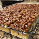These Pecan Pie Cake Bars combine a soft cake base with gooey pecan pie filling for a chewy, nutty Southern dessert perfect for holidays.