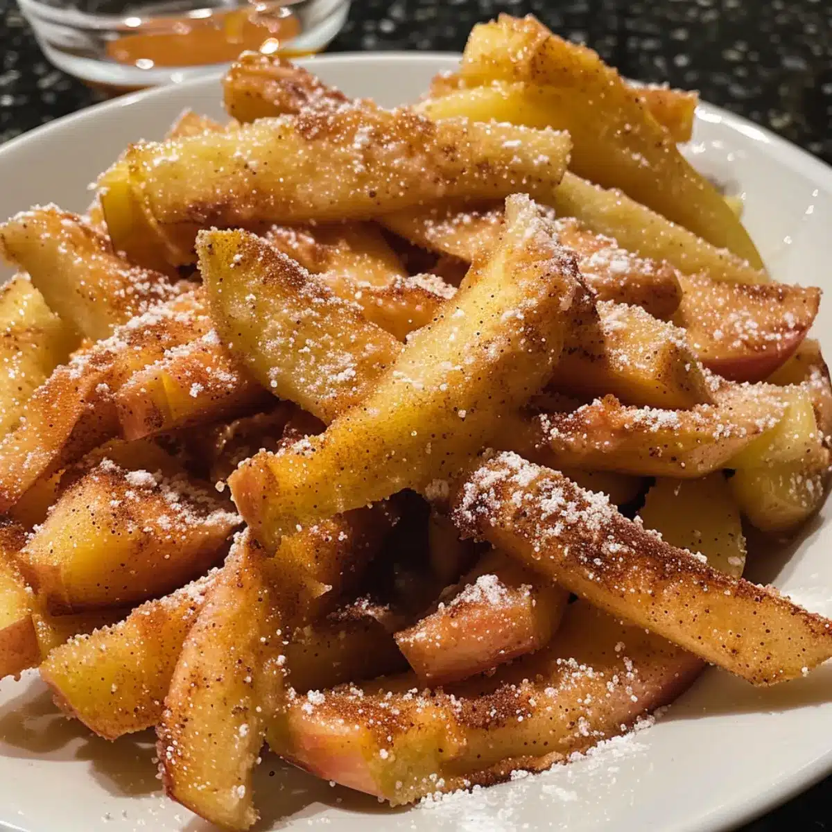 These Air Fryer Apple Fries are crispy outside, tender inside, and coated in cinnamon sugar. A quick and healthy fall snack or dessert!