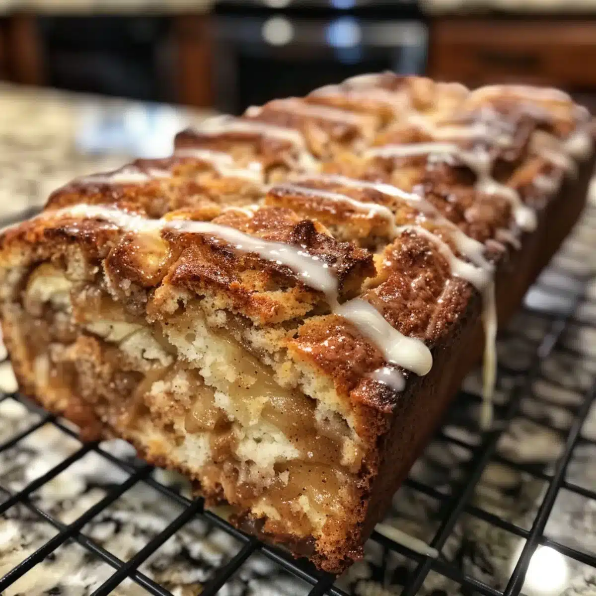 This Cinnamon Swirl Apple Fritter Bread is moist, sweet, and loaded with apples, cinnamon sugar, and glaze. A cozy fall dessert or breakfast!