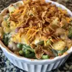 Creamy green bean and potato casserole combines tender potatoes, crisp beans, and cheesy sauce for the perfect comfort food side dish!