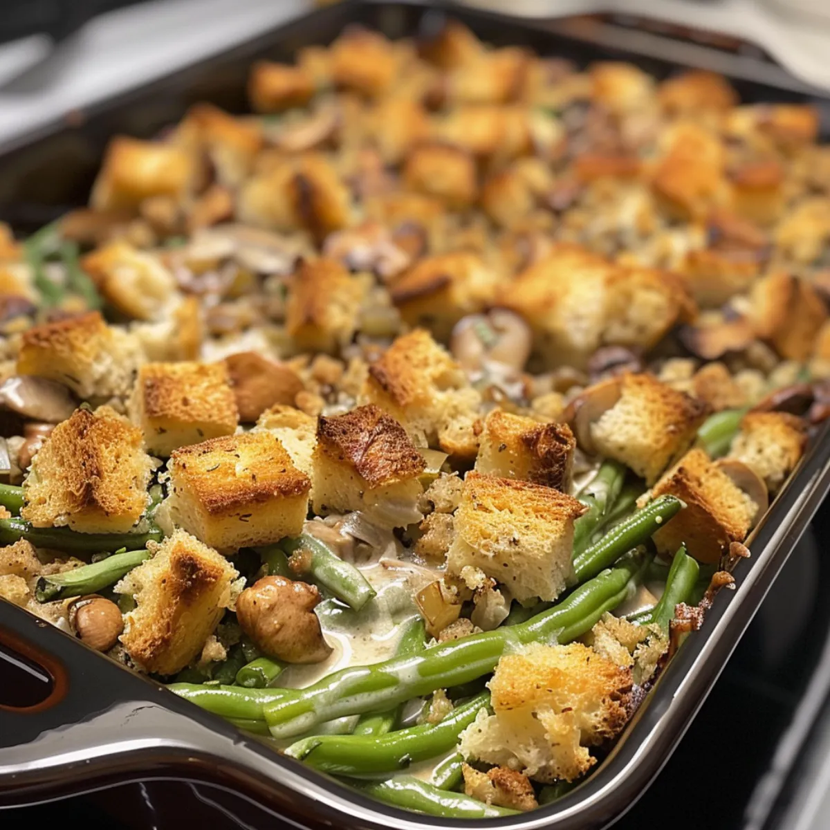 Green bean stuffing casserole blends tender green beans, savory stuffing, and creamy sauce for a cozy holiday side dish!