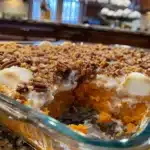 Southern sweet potato casserole with creamy spiced filling and crunchy pecan topping—perfect for Thanksgiving or holiday gatherings!