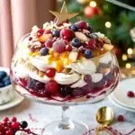 Christmas Pavlova Trifle is a stunning layered dessert of meringue, whipped cream, custard, and berries. Light, creamy, and perfect for holiday celebrations.