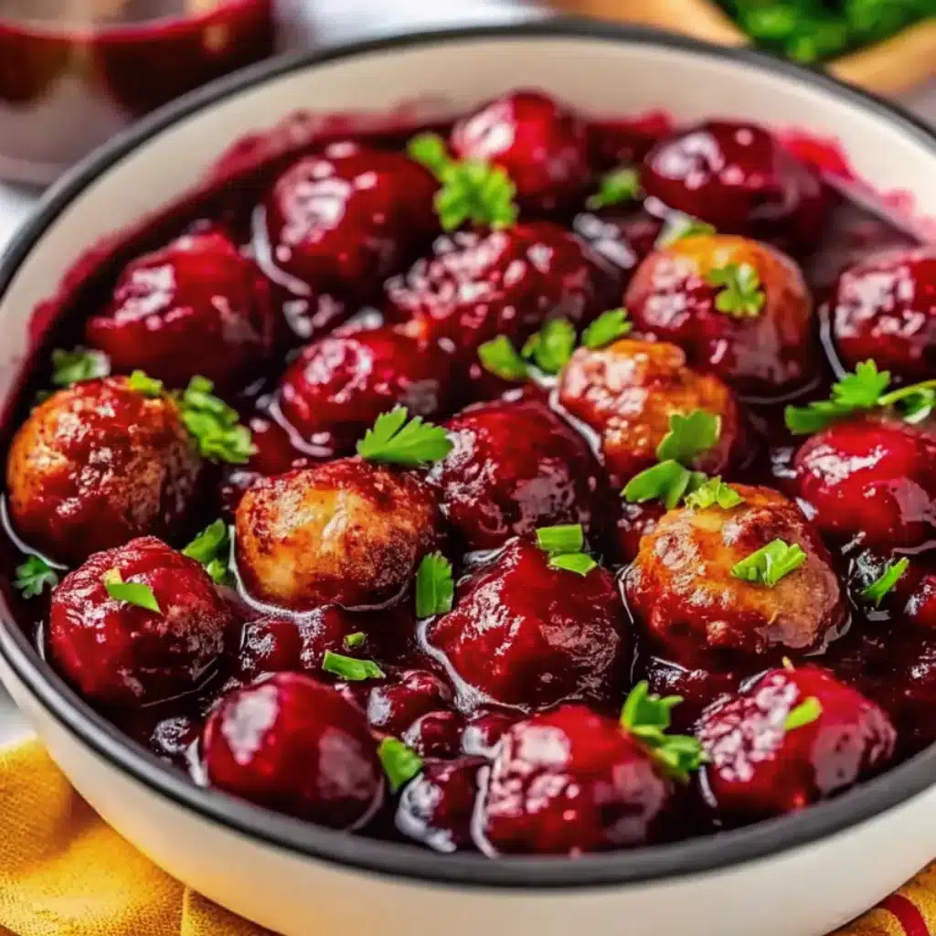 Juicy homemade meatballs simmered in sweet cranberry chili sauce. Perfect festive appetizer for your Christmas party.