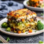 This cheesy vegetable casserole is packed with broccoli, carrots, and creamy cheese sauce. The perfect comforting side dish for any meal.