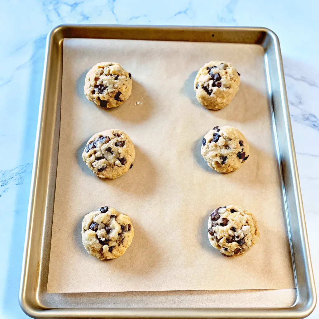 These Ultra Thick and Chewy Chocolate Chip Cookies are bakery-style, chunky, and loaded with chocolate. Crispy edges, soft centers—pure cookie perfection!