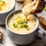 This Garlic Cheddar Cauliflower Soup is creamy, comforting, and packed with roasted flavor. A perfect cozy meal with bold flavor.