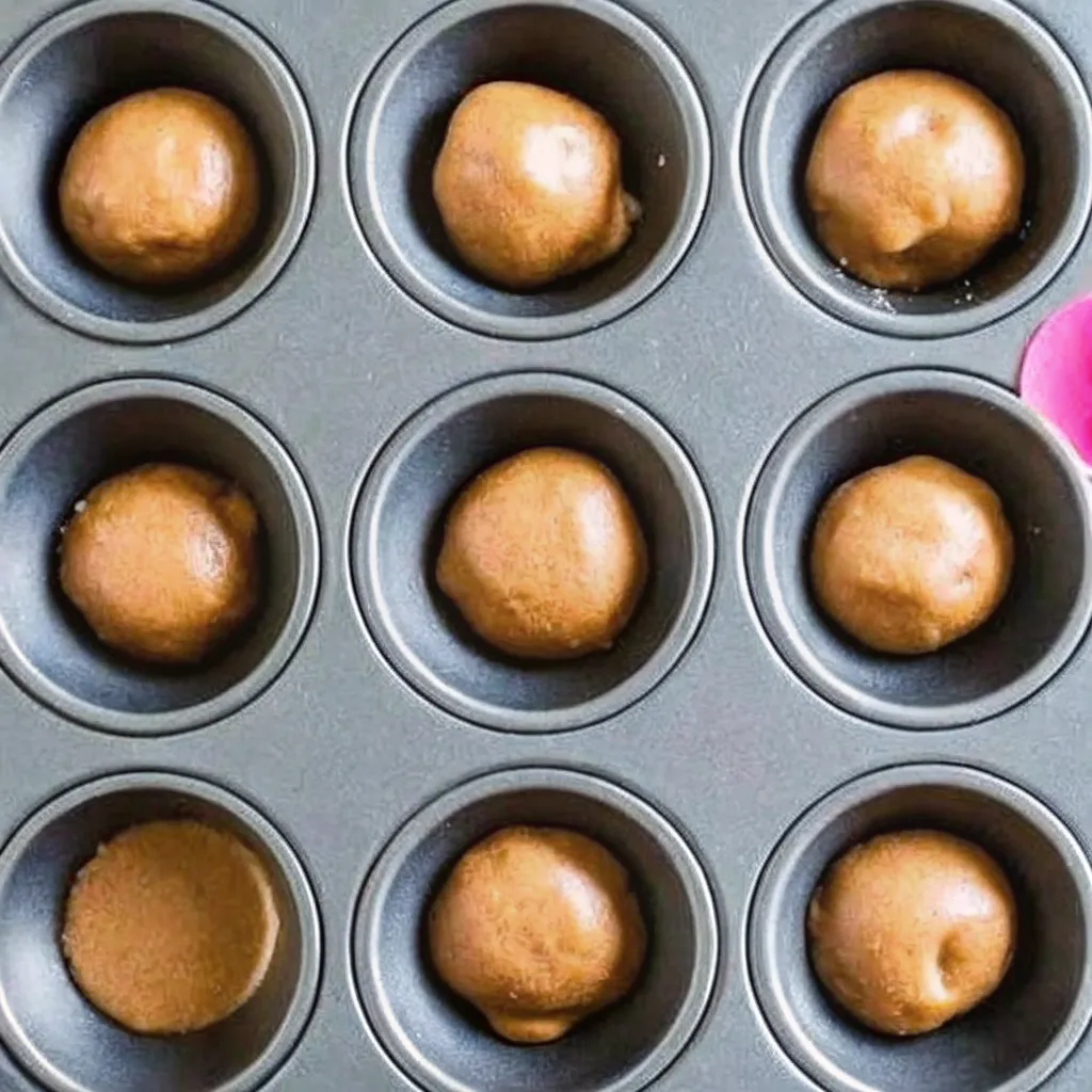 Make Gingerbread Cheesecake Cookies as soft cookie cups filled with creamy cheesecake and festive sprinkles for a fun Christmas dessert.