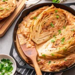 This Marry Me Melting Cabbage is oven-roasted to buttery perfection with garlic, parmesan, and cream. A must-try side dish for dinner.