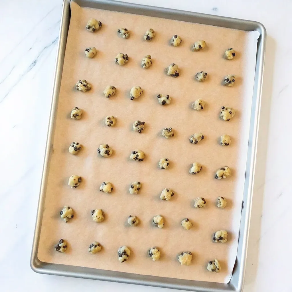 These Mini Chocolate Chip Cookies are soft in the center, crisp on the edges, and perfect for gifting. Easy, quick, and packed with chocolate chips!