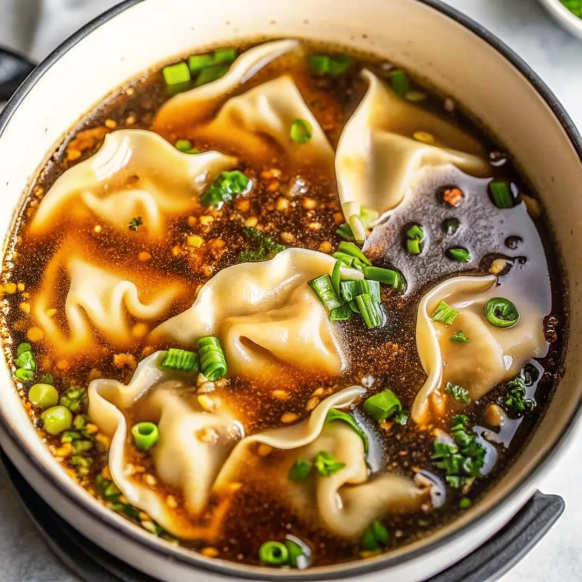 Potsticker Soup is a fast, flavorful broth filled with dumplings, veggies, and fresh herbs. A cozy meal made in under 30 minutes.