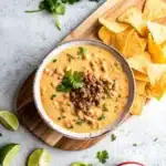 This Ground Beef Queso Dip with Velveeta is creamy, rich, and perfect for parties. A quick and flavorful cheese dip loaded with seasoned beef and Rotel.