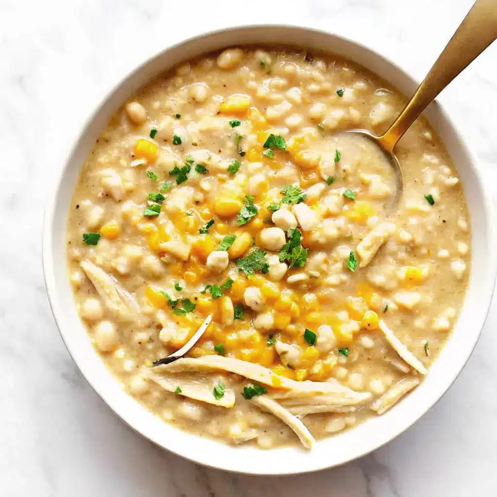 This Creamy White Chicken Chili is rich, thick, and comforting with tender chicken, white beans, corn, and melty cheese. The perfect cozy meal.